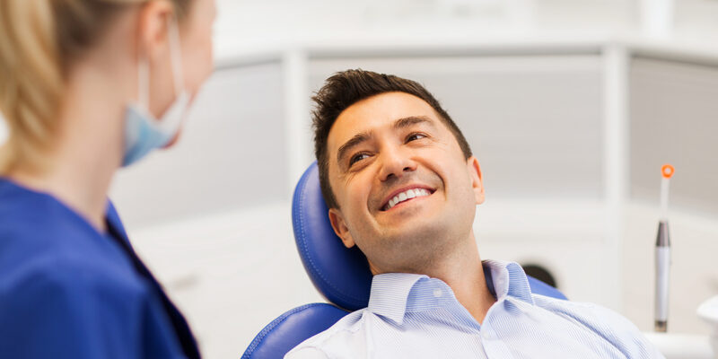 man during tooth extraction procedure at peter family and cosmetic dentistry